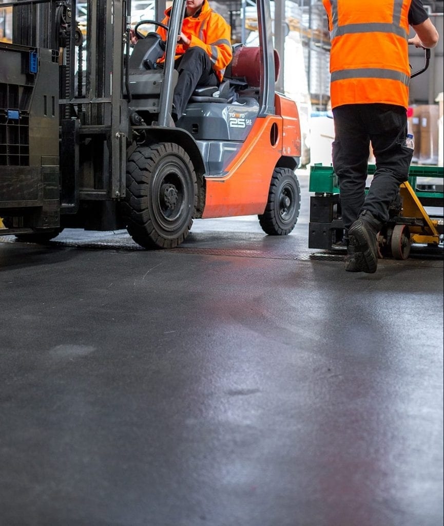 An MJF employee providing a flooring solution